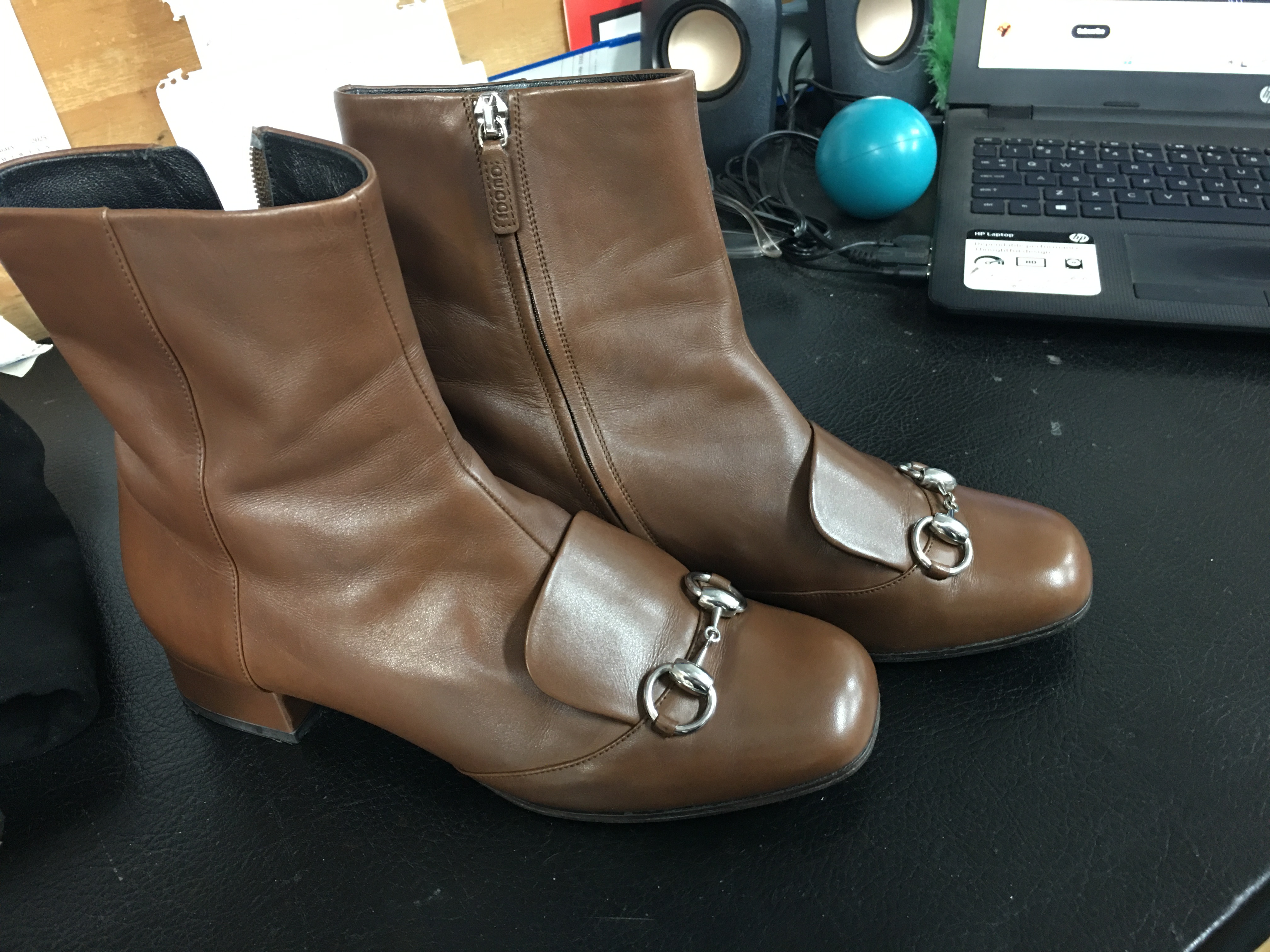 Brown Gucci horsebit ankle boots