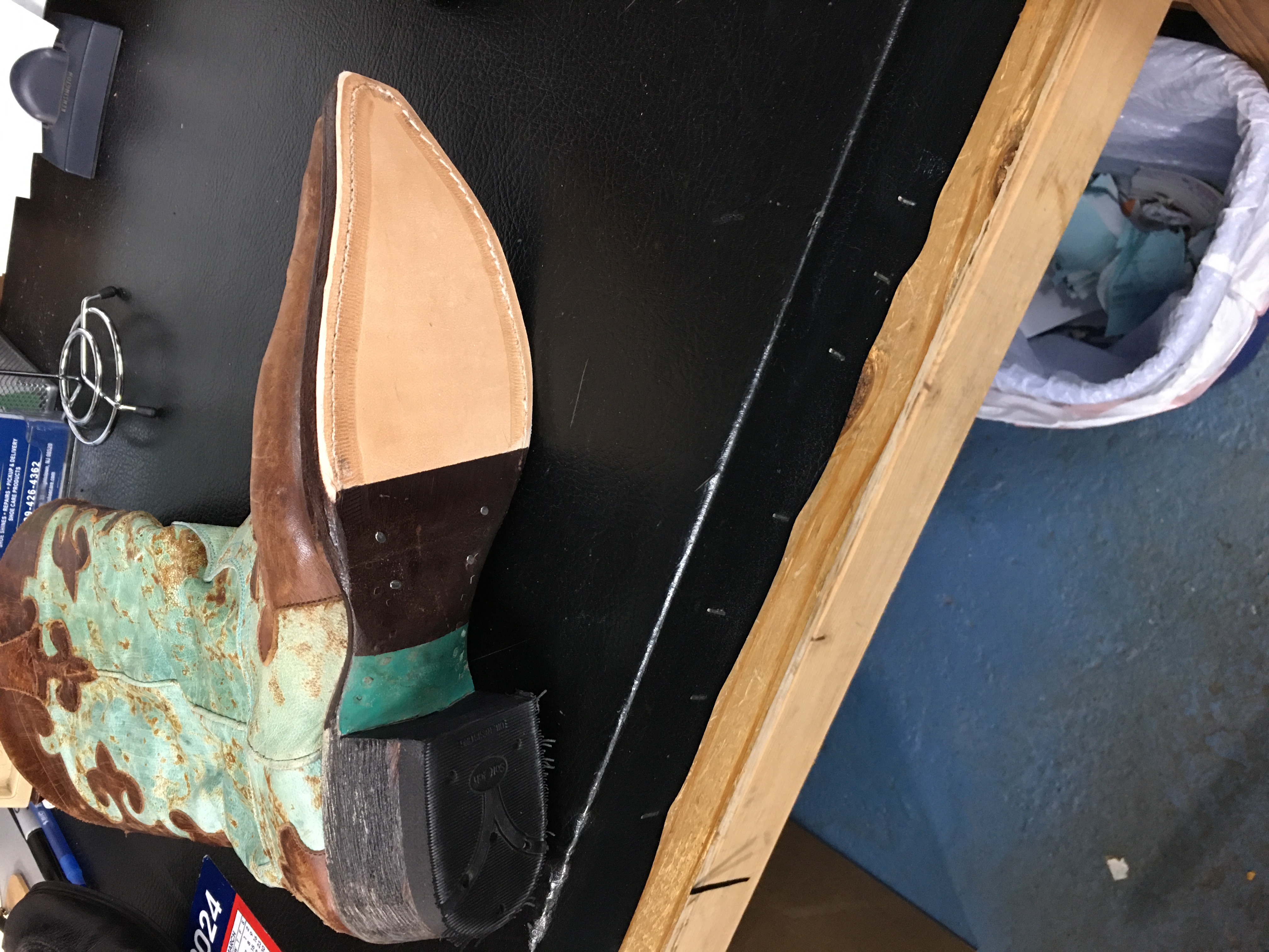 Turquoise distressed cowboy boot sole restoration